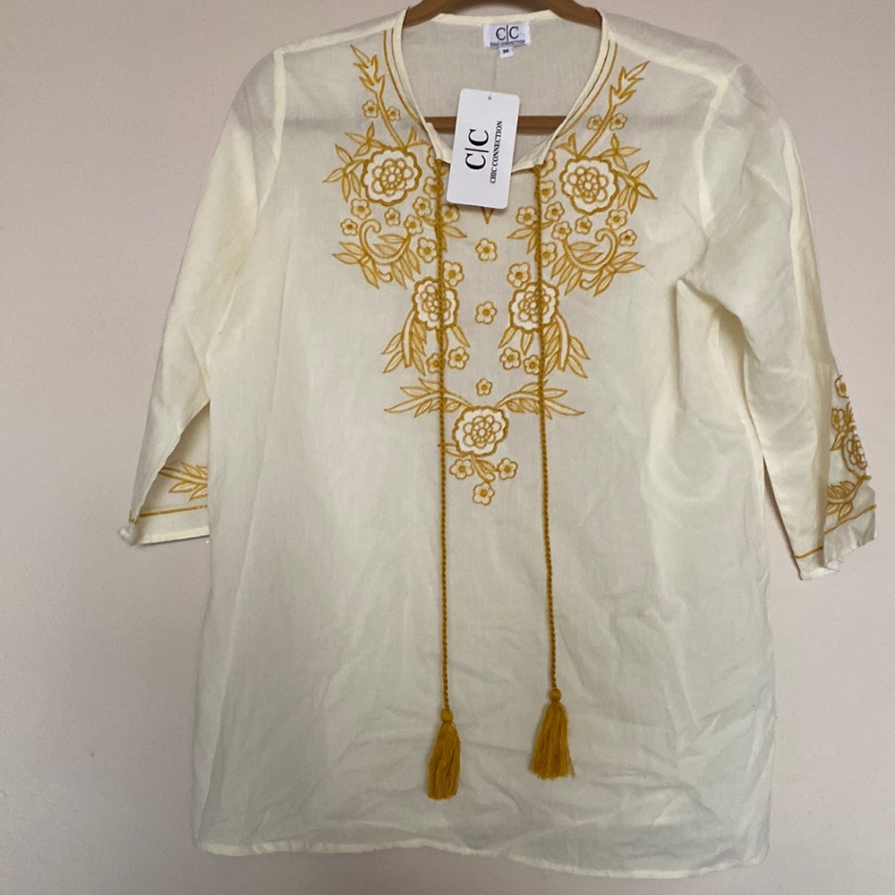 Lightweight blouse with embroidery at neck and sleeves